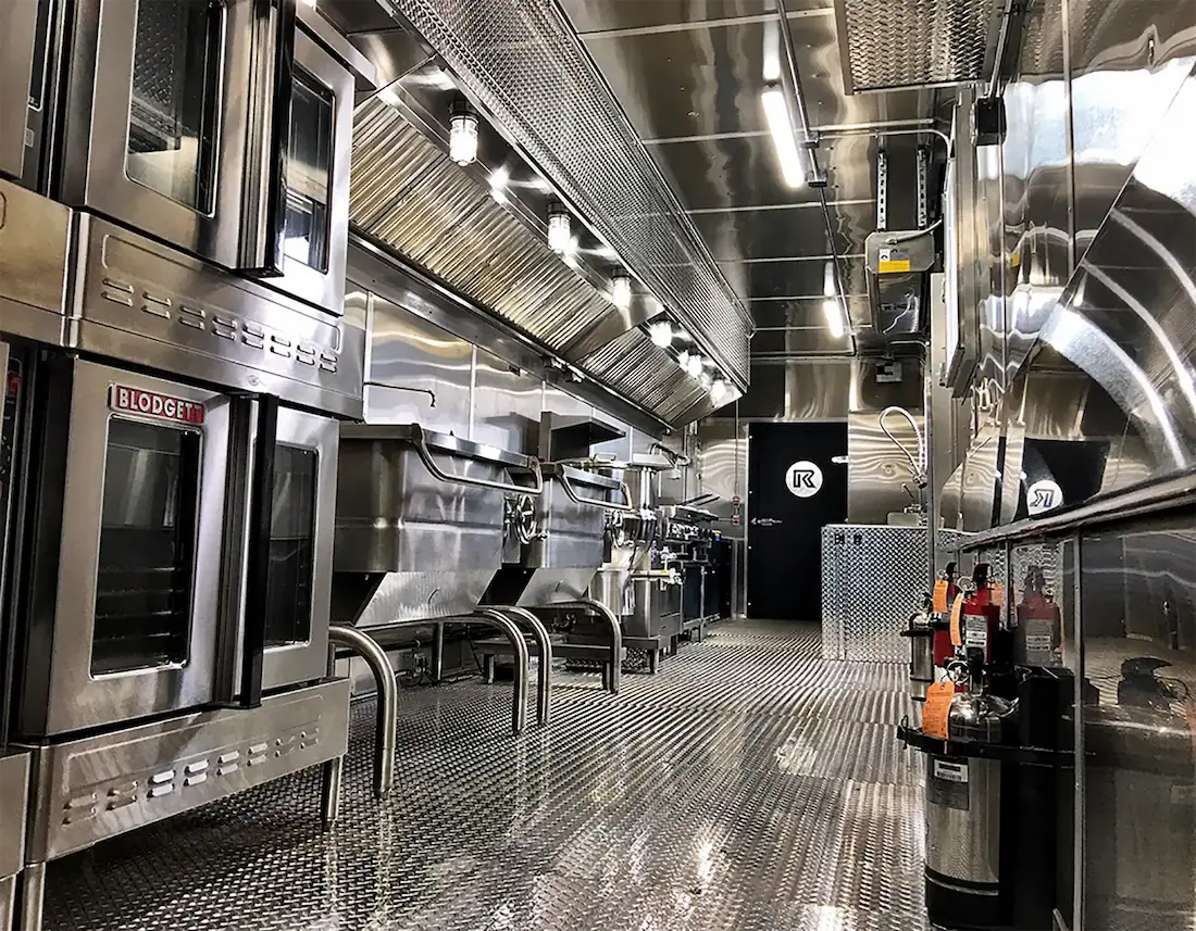 Shiny, stainless steel interior of a mobile kitchen unit
