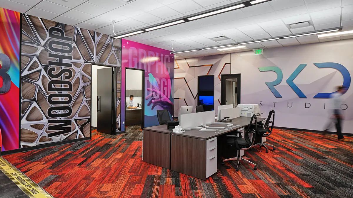 In-house creative studio featuring custom-branded wall wraps