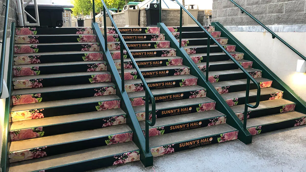 Outdoor stairway featuring custom graphic wraps and signage