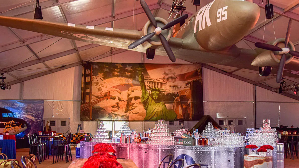 Immersive, military aviation–themed event setup inside a large tent